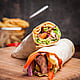 side-view-shawarma-with-fried-potatoes-board-cookware.jpg